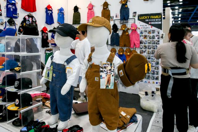 Visitors examine childcare products at the Global Baby Fair held at COEX in Seoul on Aug 8 2024 AJU PRESS Kim Dong-woo