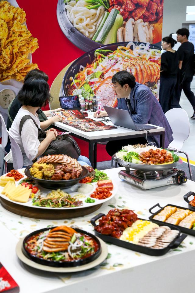 Visitors receive consultations at the 74th World Franchise Expo held at COEX in Seoul on Aug 8 2024 AJU PRESS Kim Dong-woo