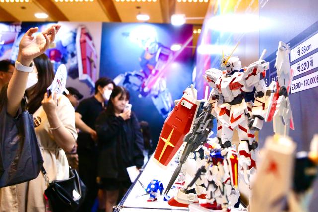 Visitors view robot exhibits at the Bandai Namco Korea FUN EXPO 2024 at COEX in Seoul on Aug 9 2024 AJU PRESS Han Jun-gu