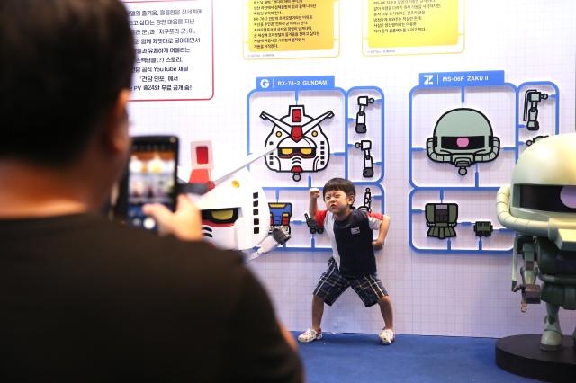 A child poses for a photo at the Bandai Namco Korea FUN EXPO 2024 at COEX in Seoul on Aug 9 2024 AJU PRESS Han Jun-gu
