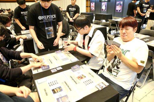 Visitors play One Piece card game at the Bandai Namco Korea FUN EXPO 2024 at COEX in Seoul on August 9 2024 AJU PRESS Han Jun-gu