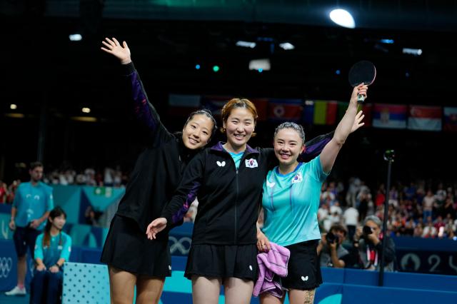 South Korea team celebrate after defeating Germany in the womens bronze medal team table tennis match at the 2024 Summer Olympics in Paris Saturday AP-Yonhap