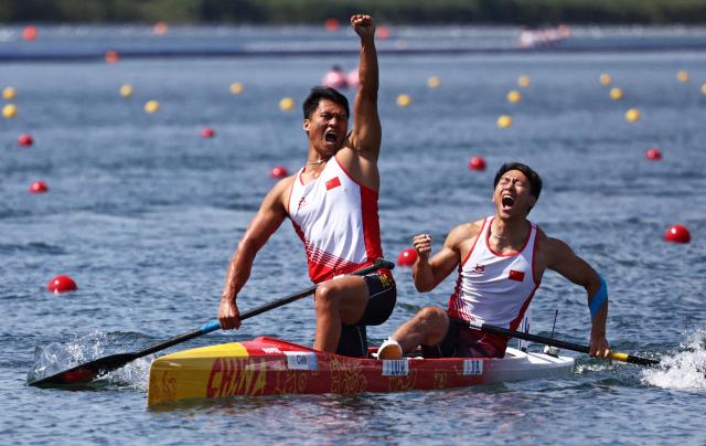 Hao Liu and Bowen Ji of China react after winning gold in the Mens Canoe Double 500m Final A at Vaires-sur-Marne Nautical Stadium on August 8 REUTERS-Yonhap