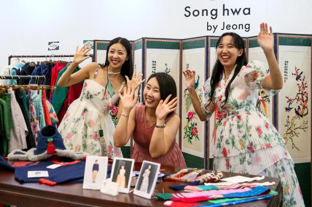 Visitors pose for photos at the Hanbok Expo held at Dongdaemun Design Plaza in Seoul on Aug 9 2024 AJU PRESS Kim Dong-woo