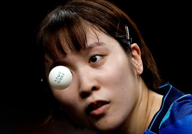 Japans Miu Hirano competes against Chinas Yingsha Sun during the Womens Team Gold Medal Match in table tennis at South Paris Arena 4 on August 10 REUTERS-Yonhap