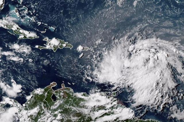 This GOES-16 GeoColor satellite image provided by National Oceanic and Atmospheric Administration NOAA shows Tropical Storm Ernesto over the Atlantic Ocean and moving westward toward the Lesser Antilles on Aug 12 2024 AP-Yonhap