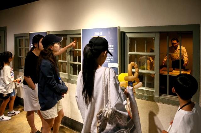 Visitors view exhibits in the exhibition hall at Seodaemun Prison Seoul on Aug 14 2024 AJU PRESS Kim Dong-woo