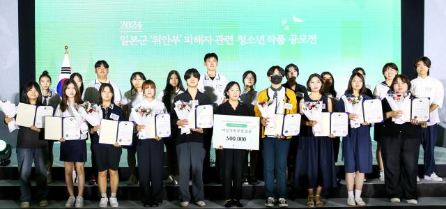 Award winners pose for a commemorative photo at the National Memorial Day event for victims of Japanese military sexual slavery in Yongsan-gu Seoul on Aug 14 2024 AJU PRESS Kim Dong-woo