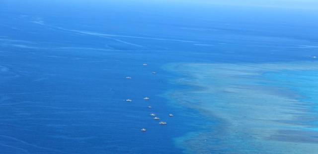 This photo shows a view of Huangyan Dao Scarborough Shoa a disputed area in the South China Sea photographed by the Philippine Coast Guard on September 6 2022 Chinese Coast Guard vessels and fishing boats are visibleEPA-Yonhap