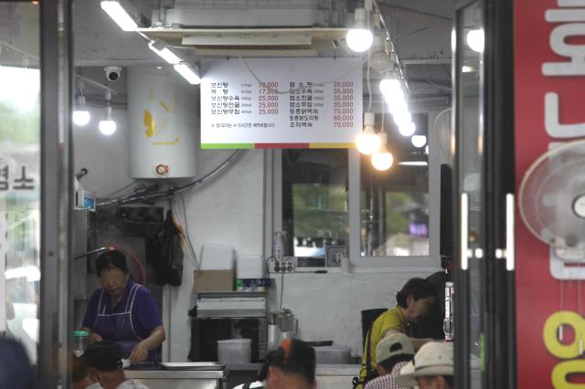 People dine at a dog meat restaurant in Moran Market Seongnam on July 24 AJU PRESS Han Jun-gu