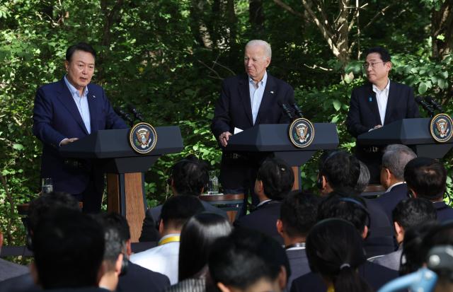 This Aug 18 2023 file photo shows South Korean President Yoon Suk Yeol left speaks during a joint news conference following a trilateral summit with US President Joe Biden center and Japanese Prime Minister Fumio Kishida at the Camp David presidential retreat in Maryland Yonhap