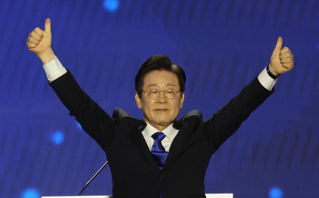 Lee Jae-myung celebrates his reelection as chairman of the main opposition Democratic Party at Olympic Park in southern Seoul on Aug 18 2024 Yonhap