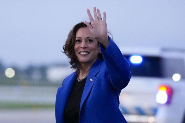 Democratic presidential nominee Vice President Kamala Harris waves during her arrival at OHare International Airport in Chicago on Aug 18 2024 AP-Yonhap