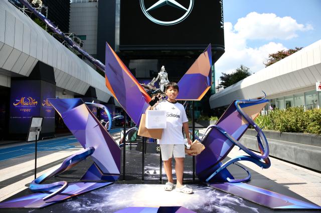 A visitor strikes a pose for a photo at the 2024 Valorant Champions Seoul pop-up event at COEX Millennium Plaza in Seoul on Aug 19 2024 AJU PRESS Han Jun-gu