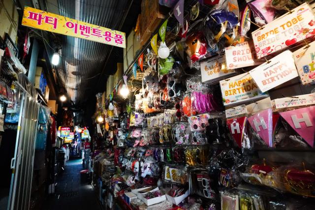 A party supplies store at the entrance of Braised Cutlassfish Alley Namdaemun Market central Seoul Aug 19 2024