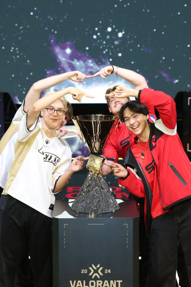 Members of the finalist teams Heretics and Sentinels pose with the trophy at the media day ahead of the 2024 Valorant Champions Seoul finals series at LoL Park in Seoul on Aug 21 AJU PRESS Han Jun-gu