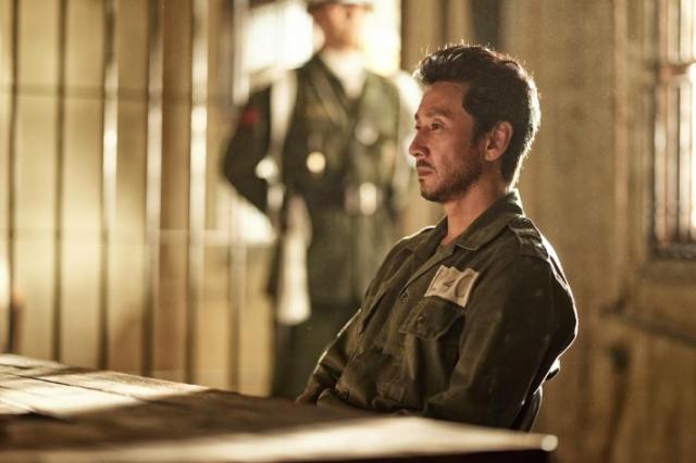 This image shows  Lee Sun-kyun who plays a colonel involved in the assasination of the president in Land of Happiness   Courtesy of NEW