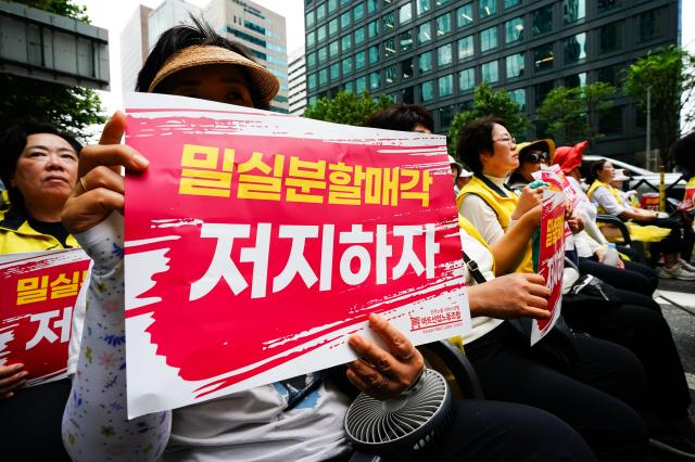 Protesters hold signs opposing the split-sale of Homeplus in front of MBK Partners headquarters in Jongno district Seoul Aug 22 2024