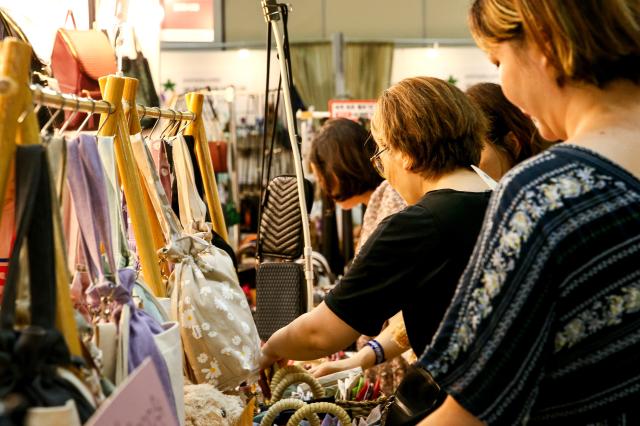 Visitors view handmade products at the Hand Arti Korea exhibition at COEX in Seoul on Aug 22 2024 AJU PRESS Kim Dong-woo