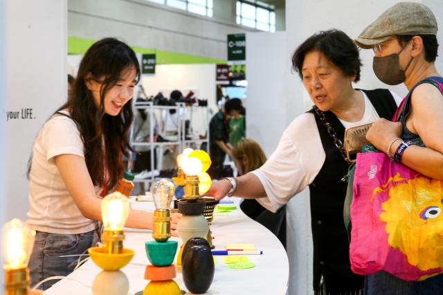 Visitors view handmade products at the Hand Arti Korea exhibition at COEX in Seoul on Aug 22 2024 AJU PRESS Kim Dong-woo