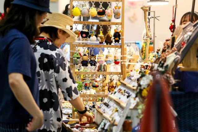 Visitors view handmade products at the Hand Arti Korea exhibition at COEX in Seoul on Aug 22 2024 AJU PRESS Kim Dong-woo