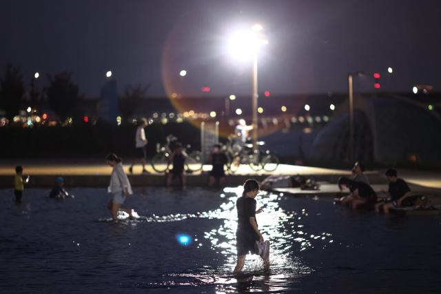 Seoul citizens enjoy water fountain at night in Han River Park in Seoul Korea on Aug 20 2024