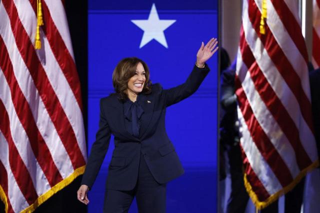 Democratic presidential nominee Vice President Kamala Harris waves during the Democratic National Convention in Chicago on Aug 22 2024 AP-Yonhap