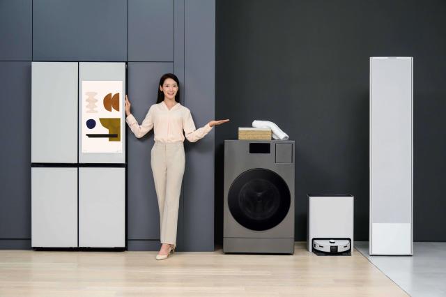 A model demonstrates the Bespoke AI appliances Courtesy of Samsung Electronics