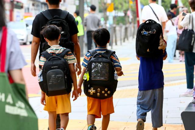 Students are on their way to school in the childrens protection zone in front of Hyehwa Elementary School in Seoul on Aug 26 2024 AJU PRESS Kim Dong-woo