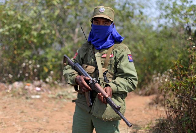 A soldier from a Myanmar ethnic armed group stands guard in a conflict-affected region Reuters-Yonhap