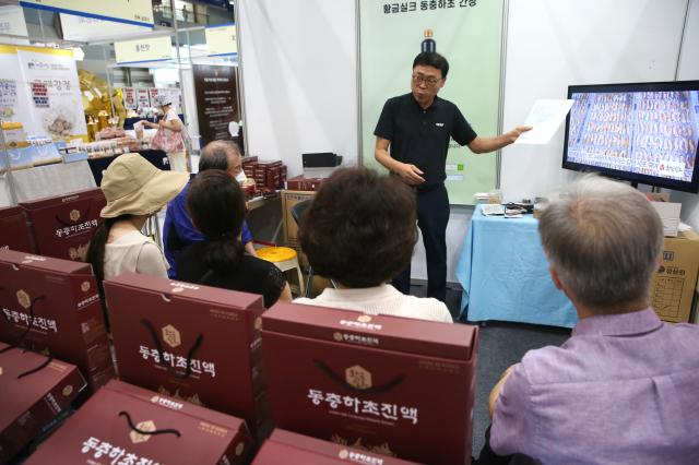 An official introduces their products to visitors at the 2024 Festive Gift Fair at COEX in Seoul on Aug 26 2024 AJU PRESS Han Jun-gu