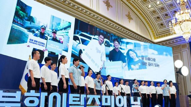 The photo shows a choir of students from both South and North Korea singing in celebration of North Korean Defectors Day at the Blue House State Guest House in central Seoul on July 14 2024 Yonhap