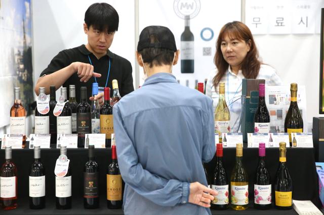 A visitor examines wine at the 2024 Festive Gift Fair at COEX in Seoul on Aug 26 2024 AJU PRESS Han Jun-gu