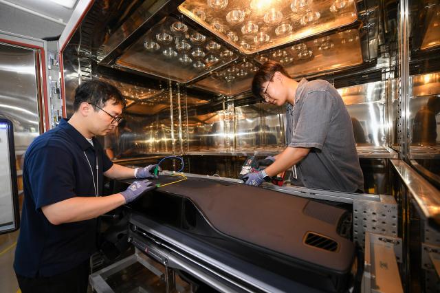 A photo of Hyundai Mobis researchers testing endurance of their cockpits made from recycled materials Courtesy of Hyundai Mobis