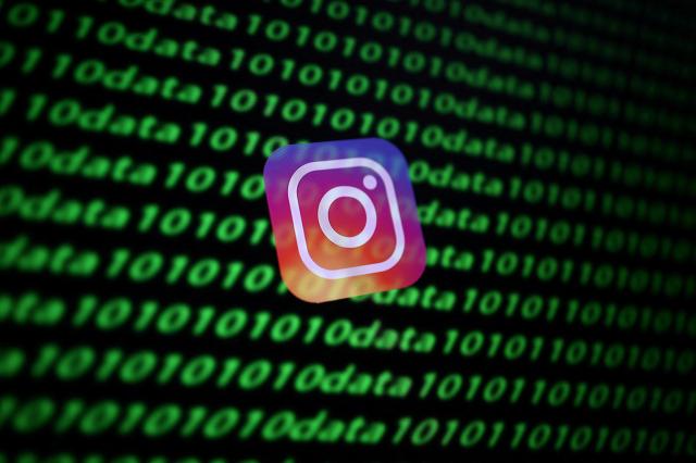 The image displays Instagrams icon alongside digital binary code captured on November 26 2019REUTERS-Yonhap