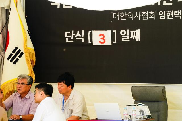 KMA officials hold a meeting in the protest tent outside their headquarters in Seoul Aug 28 2024 President Lims seat is empty as he continues his hunger strike for the third day AJP Park Jong-hyeok