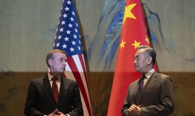 Chinese Foreign Minister Wang Yi right and Joe Bidens National Security Advisor Jake Sullivan left stare each other in Beijing on August 27 2024 AP-Yonhap