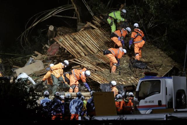 Rescue workers search for missing residents amid the ruins of a house collapsed due to heavy rain triggered by typhoon Shanshan in Gamagori Aichi Prefecture central Japan August 28 2024 EPAJIJI PRESS - Yonhap