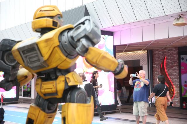 A visitor takes a photo of the Transformers One character statues installed at COEX Millennium Plaza Seoul on August 26 2024 AJP Han Jun-gu