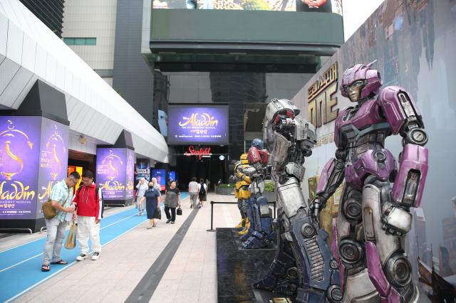 People walk at the Transformers One character statues installed at COEX Millennium Plaza Seoul on August 26 2024 AJP Han Jun-gu