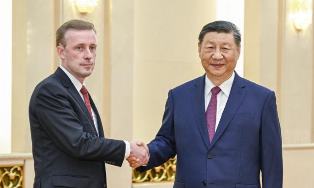 Chinese President Xi Jinping shakes hands with Bidens national security advisor Jake Sullivan at the Great Hall of the People in Beijing China on August 29 2024 Xinhua-Yonhap