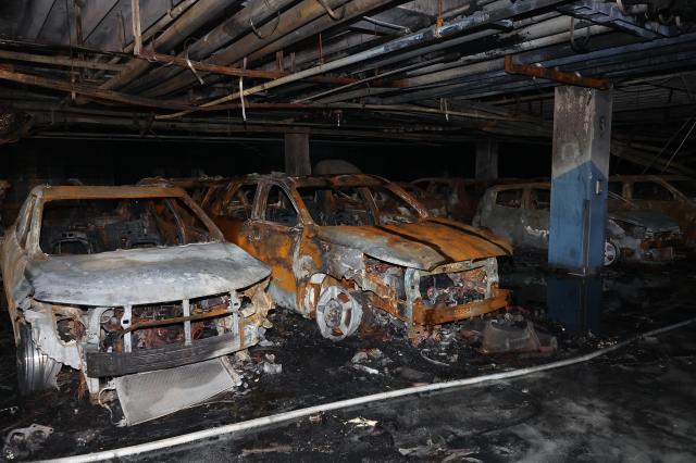 This is a photo of burnt cars in an underground parking lot in Incheon, south of Seoul, due to an electric vehicle (EV) induced fire, Aug. 2, 2024. Yonhap