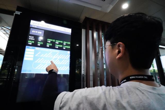 A visitor points to an information display inside the Dangsan Metropolitan Transfer Centers waiting area in Yeongdeungpo District Seoul Aug 30 2024 AJP Park Jong-hyeok