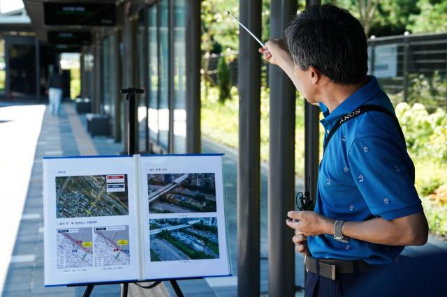 A Seoul city official explains the construction process of the Dangsan Metropolitan Transfer Center in Yeongdeungpo District Seoul Aug 30 2024 ahead of its opening AJP Park Jong-hyeok