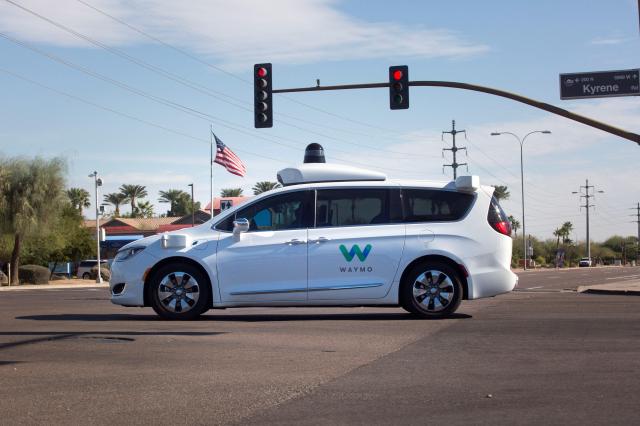 This is a photo of autonomous vehicle company Waymos robot taxi moving through an intersection in Chandler Arizona US Dec 2 2017 Reuters - Yonhap