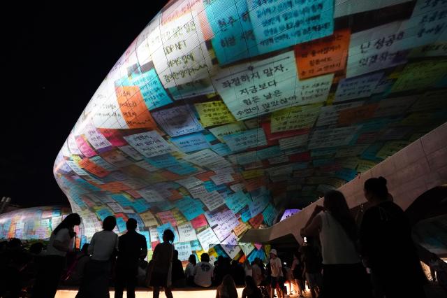 Visitors view media facade at Seoul Light DDP 2024 Autumn Aug 29 2024 AJP Park Jong-hyeok