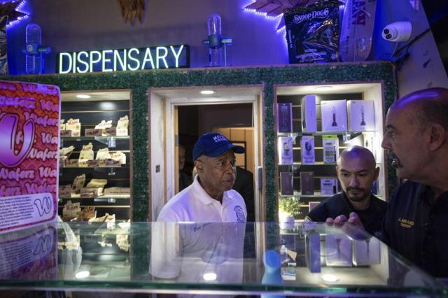 New York City Mayor Eric Adams walks through an illegal cannabis shop during an enforcement action in New York on Aug 7 2024 AP-Yonhap