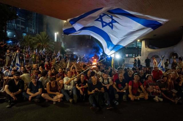 People block a road during a protest in Tel Aviv Israel on Sunday Sept 1 2024 AP-Yonhap