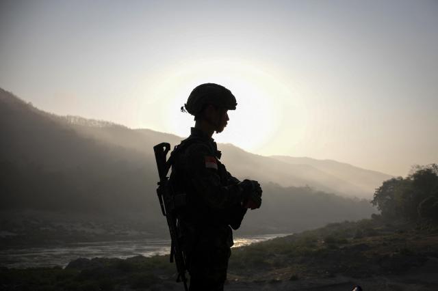 A BPLA soldier stands guard in KNLA territory in Myanmars Karen State illustrating the alliance between Bamar and ethnic minority forces in Operation 1027 a successful offensive against the military junta since October 2023 REUTERS-Yonhap