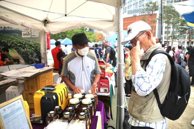 Visitors browse the booths at the 2024 Seoul Market in Seoul Plaza on Sep 2 2024 AJP Han Jun-gu